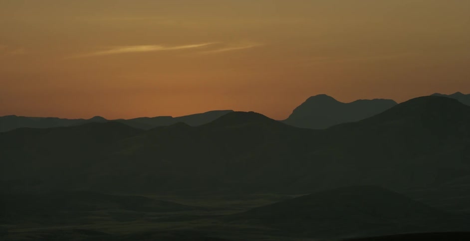 Hills in a desert at sunset
