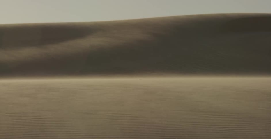 Wind is blowing sand off the dunes