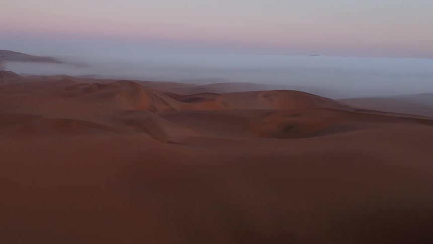 A low fog is over the desert