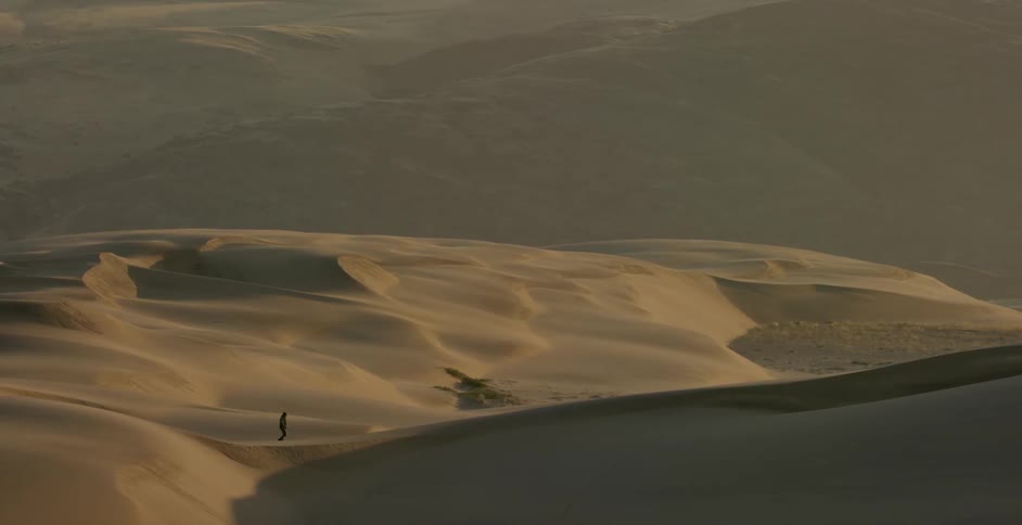 A person is hiking in the desert