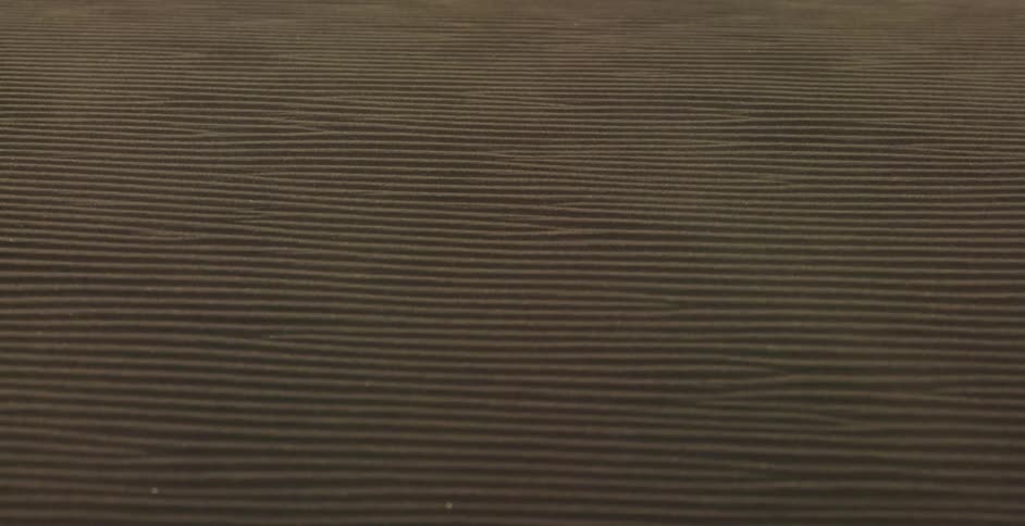 The sand being blown around in the desert towards the camera