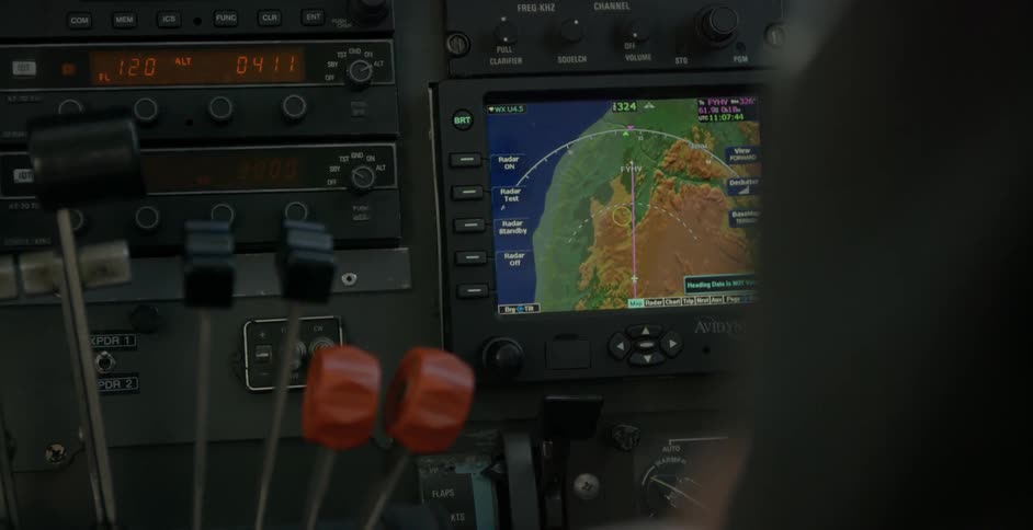 A radar screen is shown on a control panel