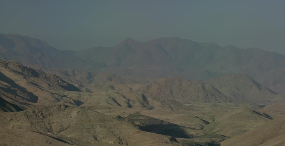 The hills and mountains are being filmed from a drone