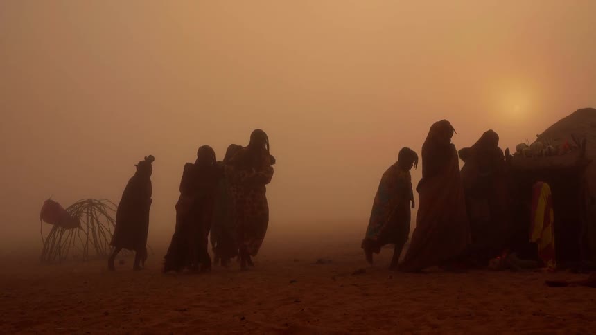 Group of people walking outside in the desert