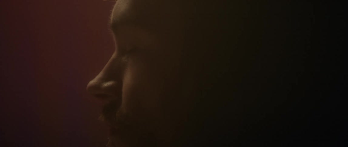 Close up of man's face in dim light