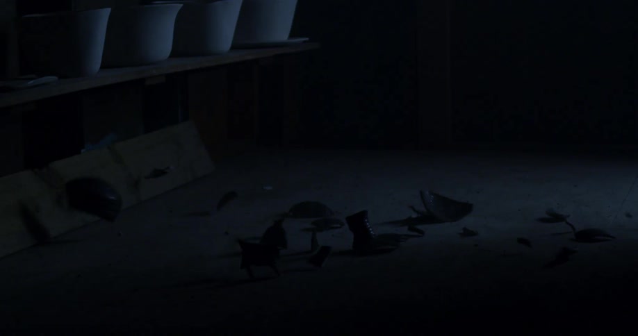 A clay pot breaks apart when it hits the floor