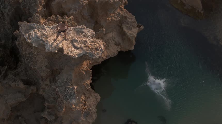 Someone jumped off a cliff into the water below