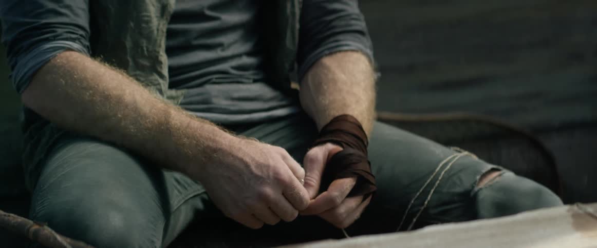 A man is working with a piece of line
