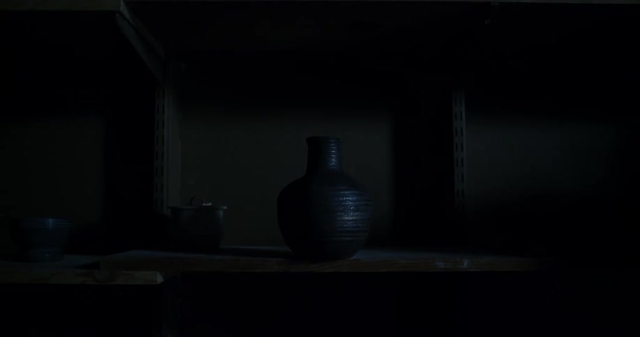A clay vase falls off the shelf as lightning illuminates it