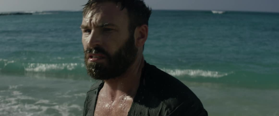 Man looking confused as he looks around on a beach