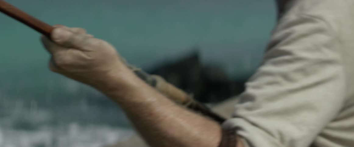 A man holds a fishing rod