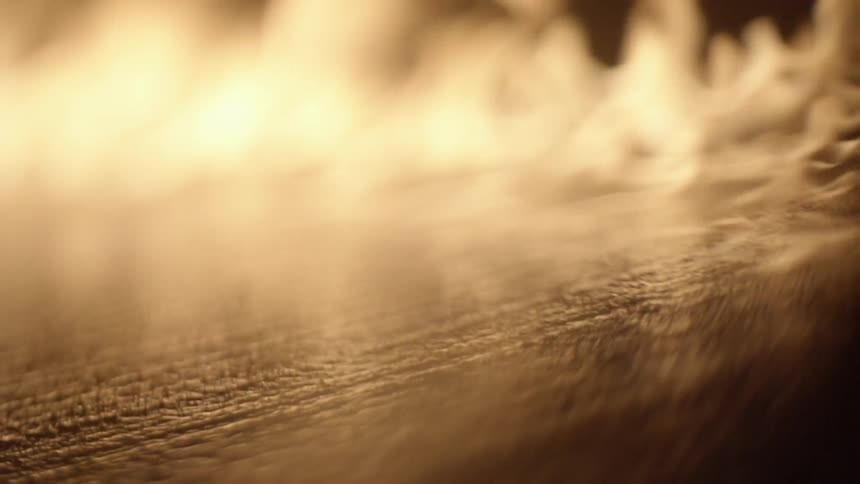 Fire raging over a surface in the dark