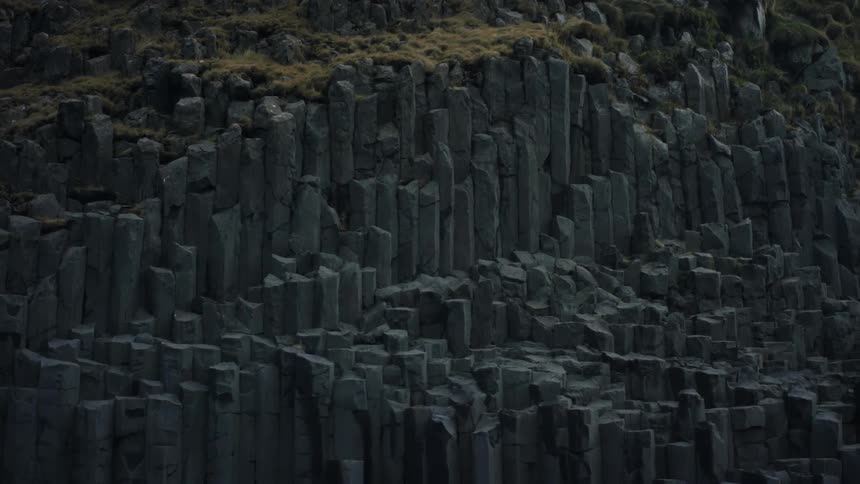 A rocky hill with tiered rock formations