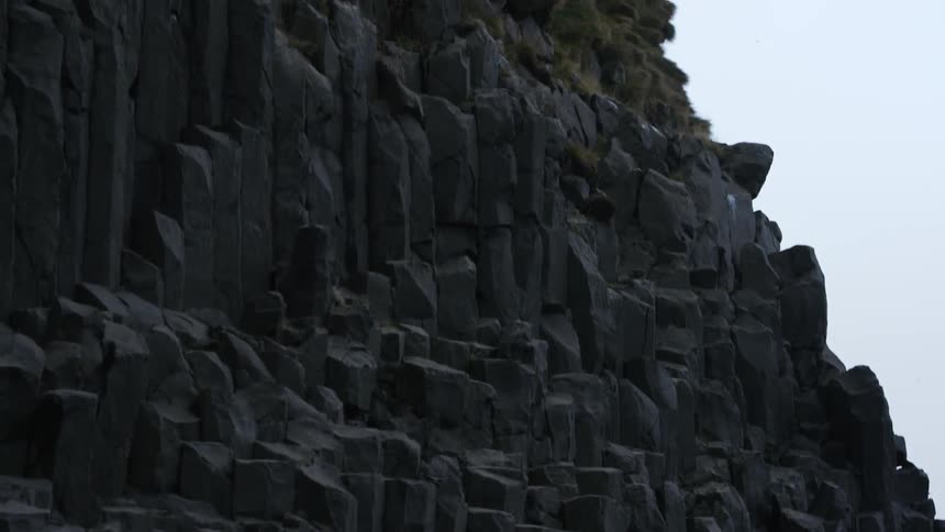 A rocky side of a mountain