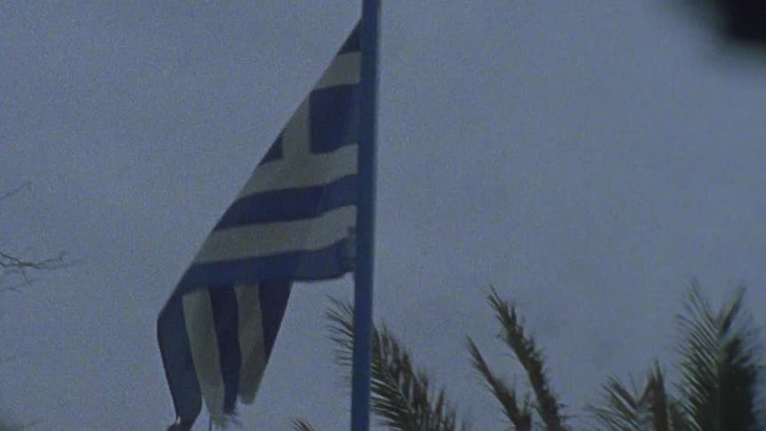 A blue and white flag blows in the wind