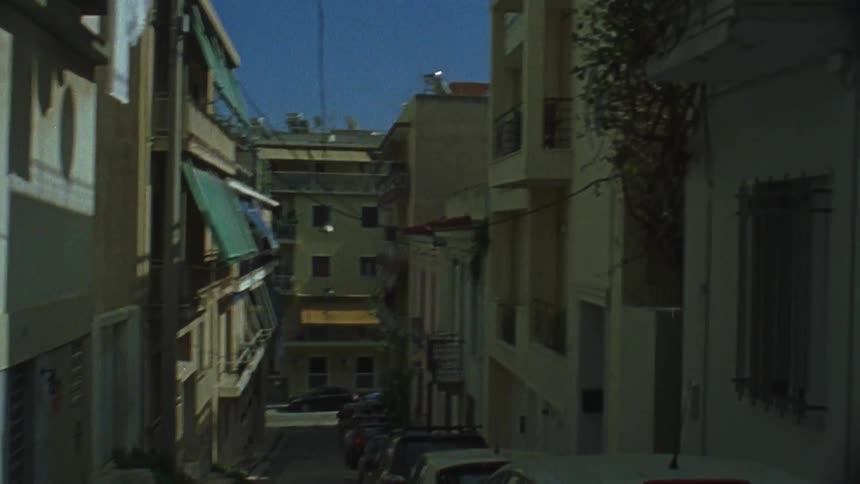 The city block is thin with many cars