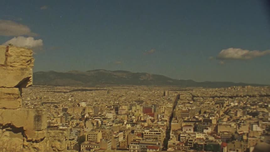 Clouds hang above a mountain city