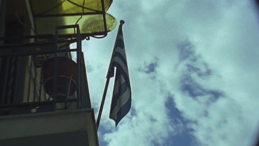 A flag blows in the wind on the balcony