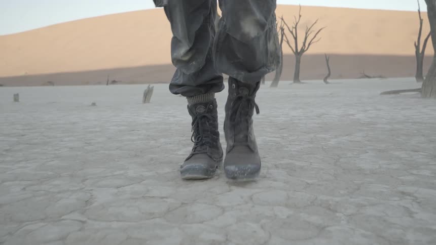 A person is marching in the desert