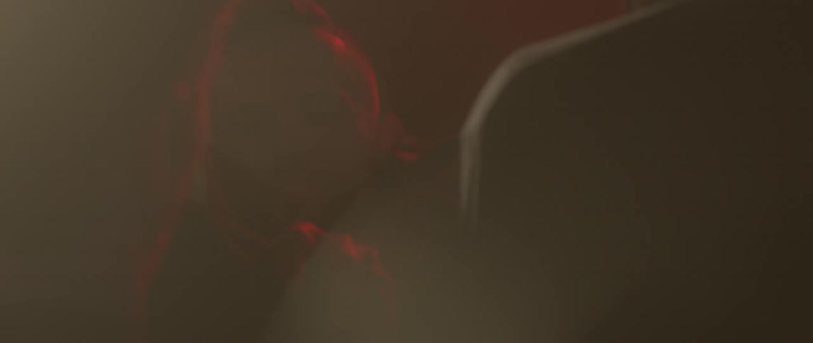 A man barges through people in a dance club