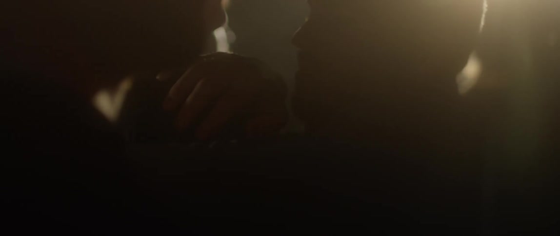 A man tries to get through a group of people in a club
