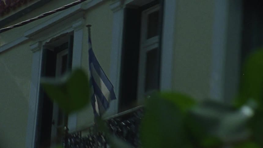 The flag is blowing on the balcony