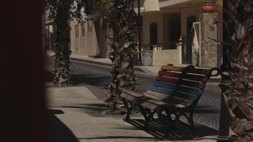 The bench on the road is empty