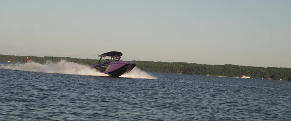 A speedboat moving at a fast pace across the sea