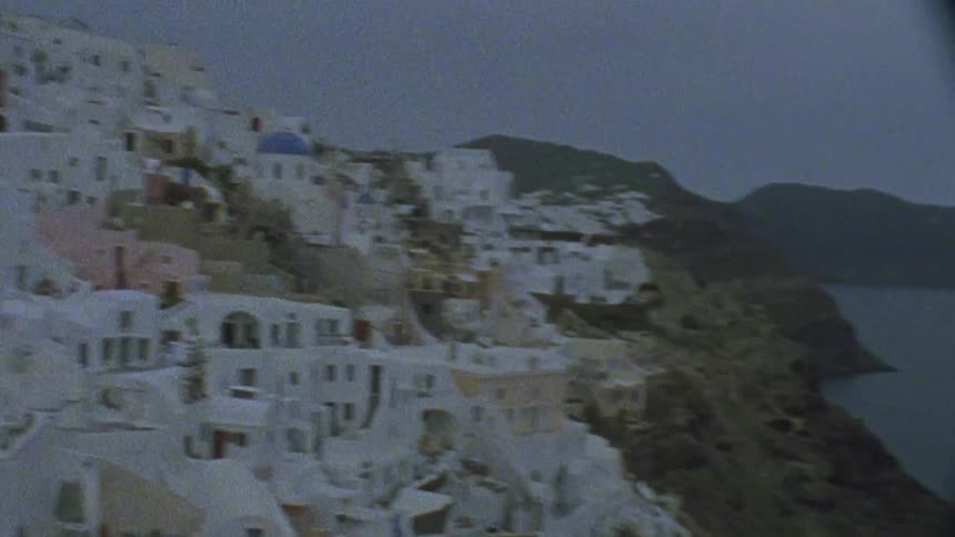 The town is on a hill by the water