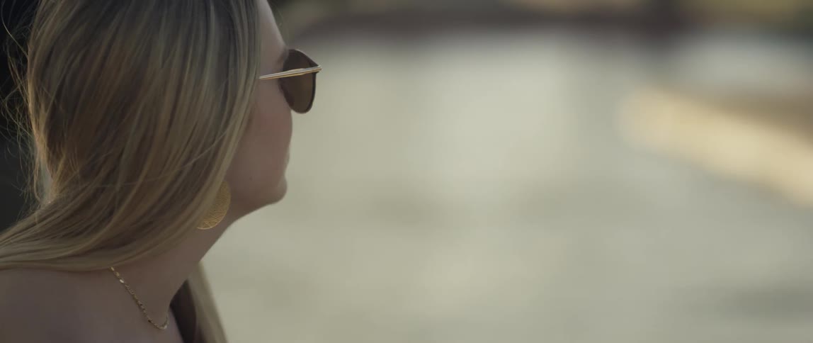 A woman looks out over the lake