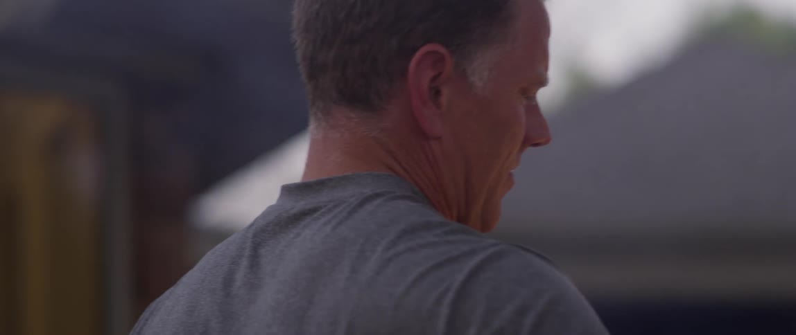 A man is cooking on a grill