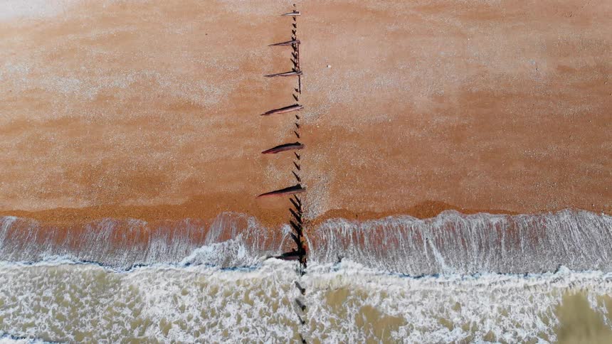 Water flows onto the shore