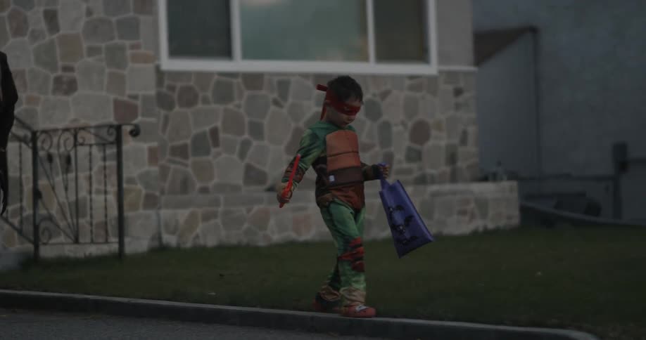 A child id dressed as a ninja turtle for halloween