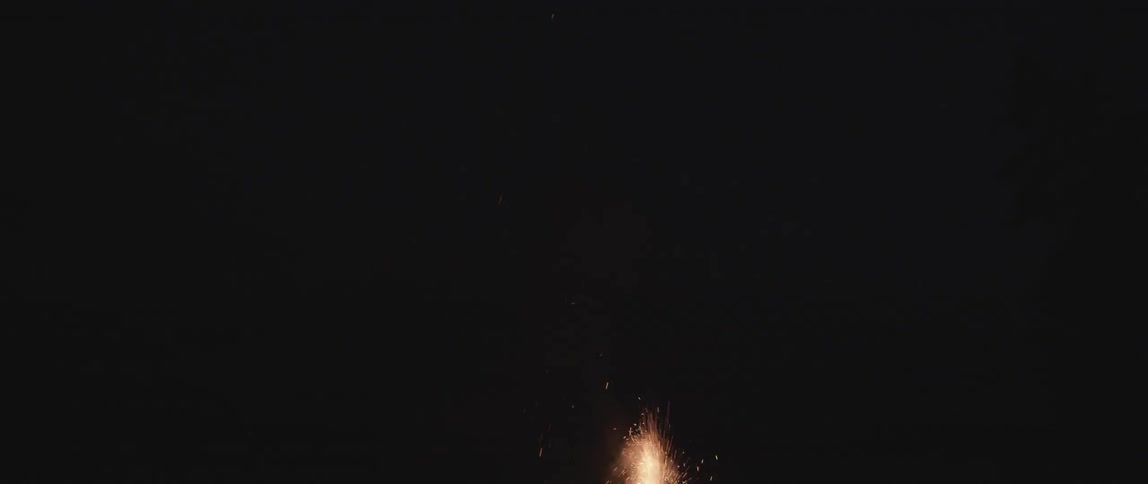 Fireworks shoot higher and higher in the night sky