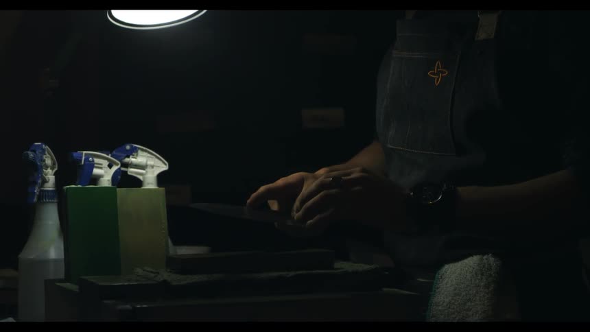 A man works at a workbench