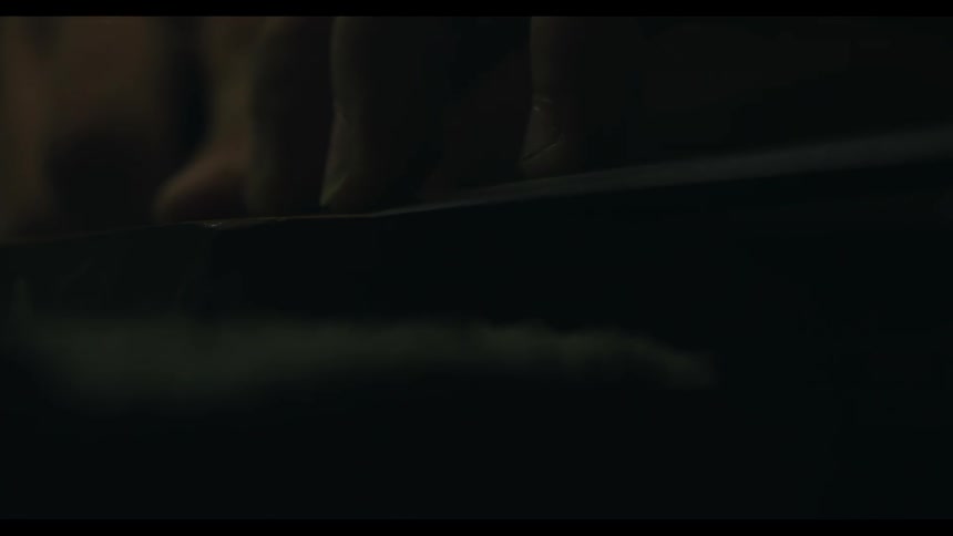 A man uses a stone to polish something