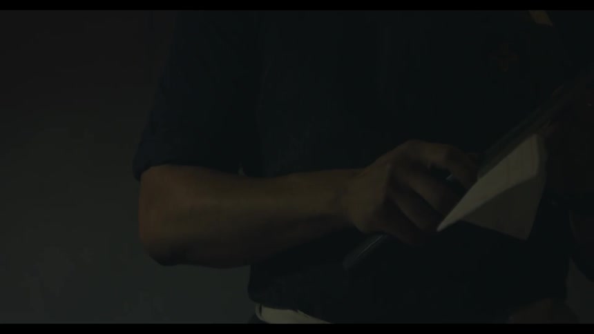 A man wipes the blade of a knife