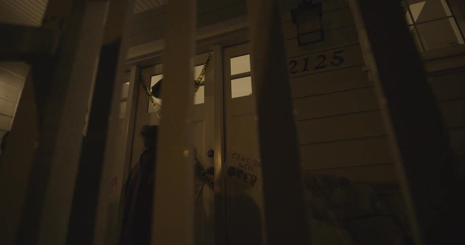 2 children are at someone's front door and one child is knocking on the door