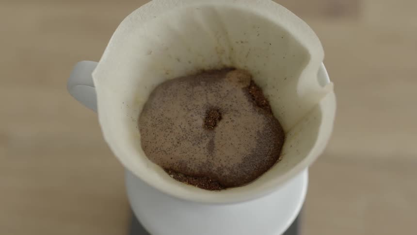 Water being poured on coffee grounds