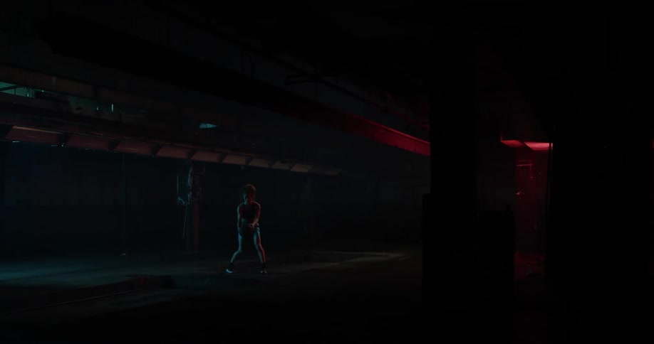 Lights blink on and off as a woman bounces a basketball