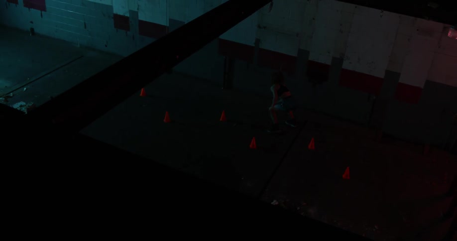 Down below in the dark gym someone is practicing