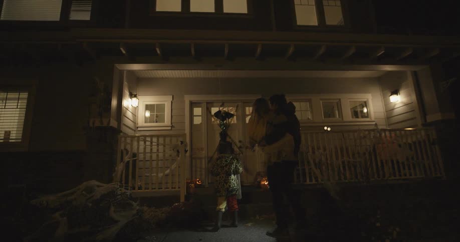Children approach a door as they are trick or treating