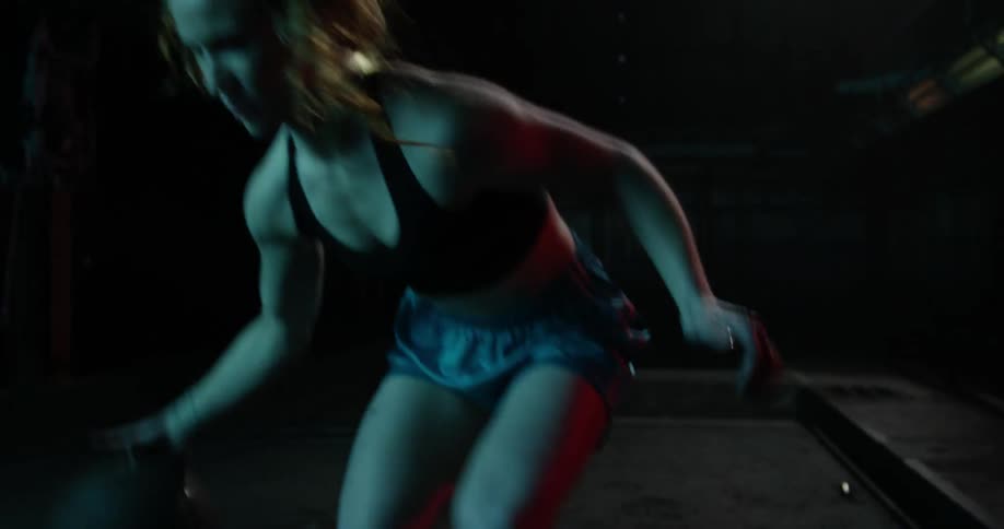 A woman bounces the ball back and forth