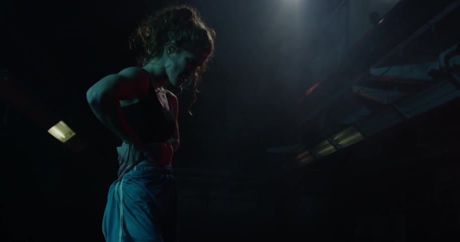 A woman attempts to catch her breath