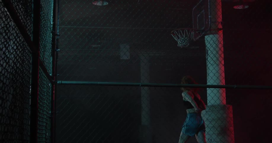 A woman shoots a basketball