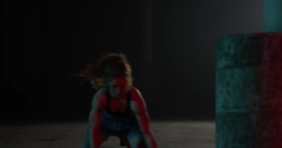 A woman dribbling a basketball takes a shot
