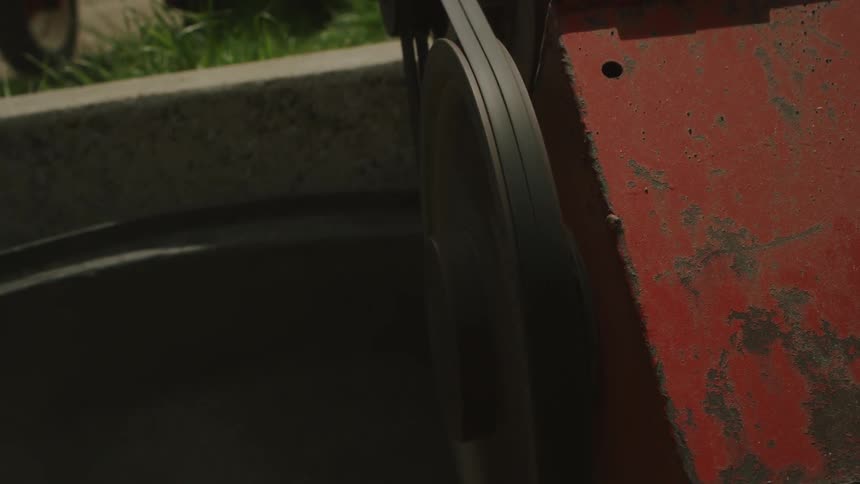 A belt on a machine is turning rapidly