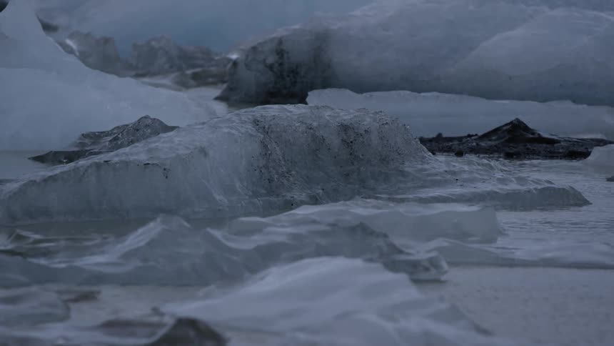 Water flows through a frozen landscape