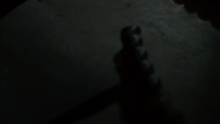An item is laying on the ground and is picked up