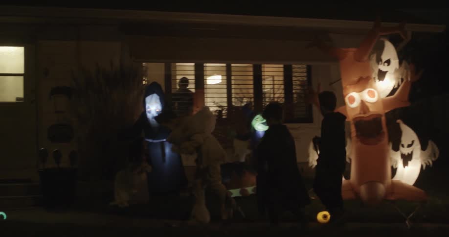 Children dressed in costumes go out on halloween